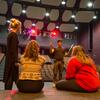 Students discussing backstage of the theater.