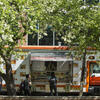 Student waling past food truck on campus.