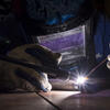 Student working with welding torch.