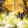 Temple students walk on Main Campus on a sunny fall day