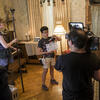 Students on a film set with sound equipment and camera 